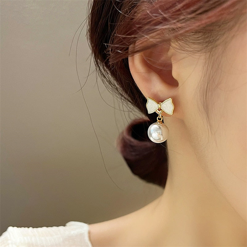 European and American Fashion Women's Simple Personality Exquisite Temperament Earrings Bow Knot Shell Pearl Earrings Jewelry - Charlie Dolly