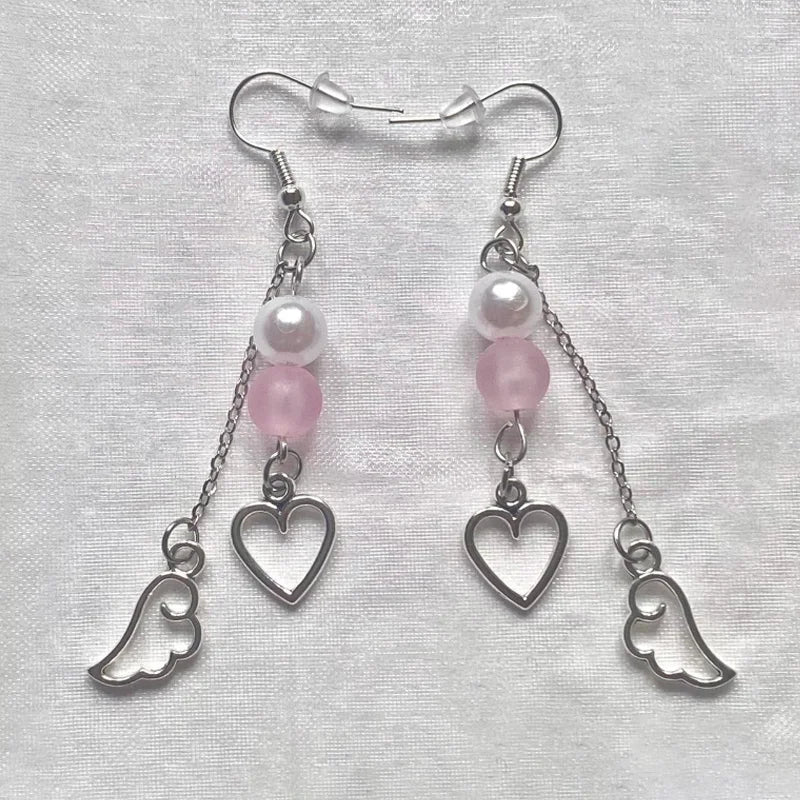 Pink beaded earrings, wing charms, boho jewelry
